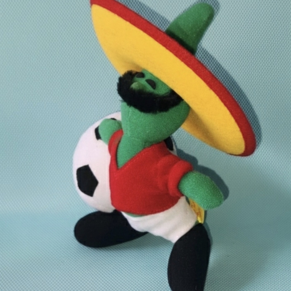 Not Rated Plush Soccer Toy with Red Shirt and Yellow Hat